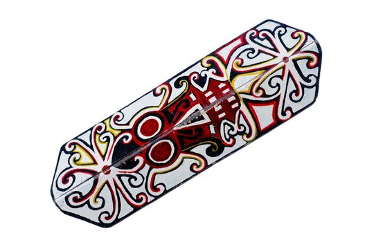 Tameng. is a traditional Indonesian shield from the Dayak tribe, made of wood, animal skins or iron with traditional carvings or paintings. Dayak Shield Isolated on white
