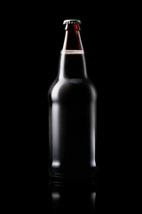 Beer bottle on a dark black background. Bottle with drink like Ipa, Pale Ale, Pilsner, Porter or Stout