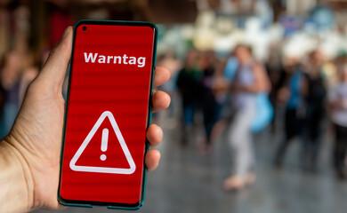 An alert on a mobile phone during the national warning day in Germany. The text 'Warntag' (warning day) appears on the display.