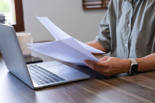 Businesswomen drive online store success together.