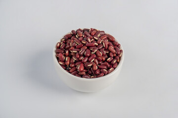 Red kidney beans in white cup on white background