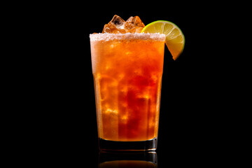 Michelada cocktail in beer glass featuring with beer, lime juice, tomato juice, spicy sauce and spices on black.