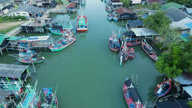 Reverse footage of this fishing village revealing fishing boats and communities, Bang Pu Fishing Village, Sam Roi Yot National Park, Prachuap Khiri Khan, Thailand.
