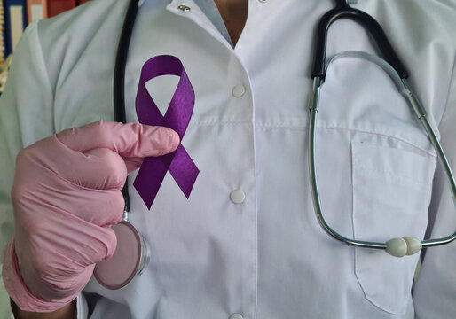 Purple ribbon awareness in doctor hand for ADD and ADHD cancer