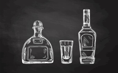 Hand-drawn bottles of tequila and shot glass with tequila on chalkboard background. Design element for the menu of bars and in engraving style. Mexican, Latin America.