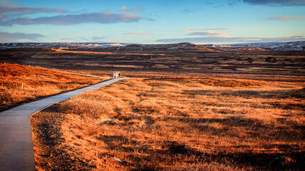 The view of the walking trail and grassland near the Gullfoss Waterfall in Winter in the dusk