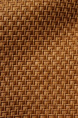 Vertical of a brown woven wavy fabric background