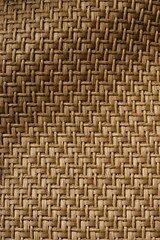 Vertical of a brown woven wavy fabric background