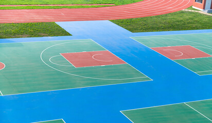 School sport field with basketball court and track