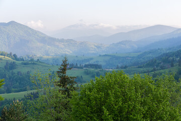 Mountain ridges in spring sunny morning in Carpathian Mountains