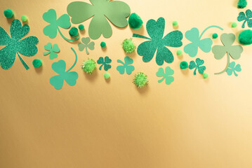 St. Patrick Day themed gold background with shamrock clover of various sizes and shades of green.