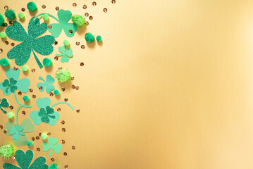 St. Patrick Day themed background.  St. Patrick Day themed gold background with shamrock clover of...