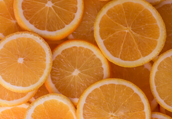 oranges cut into slices and laid out on the table as a food background 7