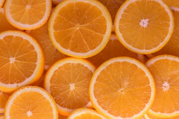oranges cut into slices and laid out on the table as a food background 8