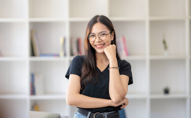 Fototapeta premium Photo of young freelance businesswoman standing smile with arms cross, looking at camera.