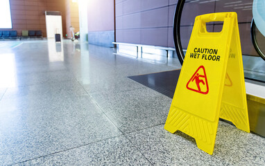 Caution wet floor sign on floor