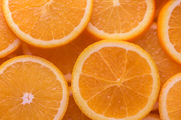 oranges cut into slices and laid out on the table as a food background 11