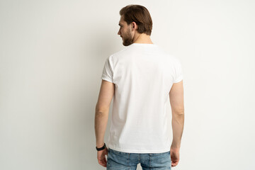 Close up of young man in blank white t-shirt rear isolated. Mock up template for design print