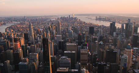 Scenic Aerial New York City View of Manhattan Residential and Office Architecture. Panoramic Evening Sunset Photo from a Helicopter. Cityscape with Skyscrapers Near Central Park in Midtown Area - obrazy, fototapety, plakaty