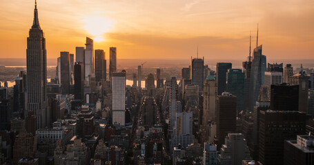 Fototapeta premium Panorama Around Manhattan in New York City, United States of America. Aerial Photo with Office Buildings, Skyscrapers and Busy Streets on a Sunny Summer Evening