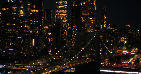 Aerial Top Down Night Scenery with Brooklyn Bridge with Car Traffic Moving in Both Directions on...