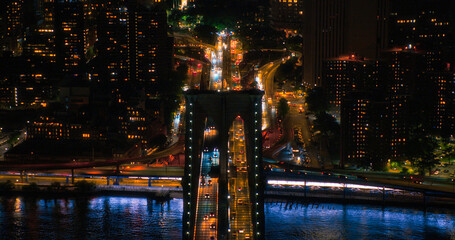 Aerial Top Down Night Scenery with Brooklyn Bridge with Car Traffic Moving in Both Directions on...