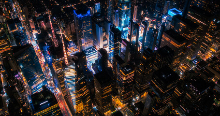 Top Down Aerial View of New York City Streets in Manhattan at Night. Helicopter Flying Along a...