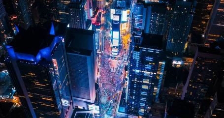 Foto op Plexiglas New York Concrete Jungle at Night. Aerial Shot from a Helicopter Tour Around Manhattan. Scenes with Modern Skyscraper Blocking the View on Crowded Times Square Area with Tourists © Gorodenkoff