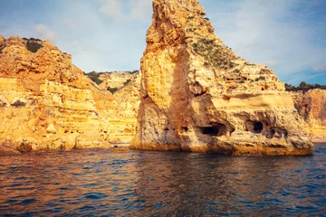 Papier Peint photo autocollant Plage de Marinha, Algarve, Portugal Coastal rocky seascape. Rocky shore near Praia da Marinha beach and Benagil in Algarve region in Atlantic ocean, Portugal, Europe