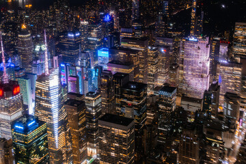 New York City Aerial Night Cityscape with Stunning Manhattan Landmarks, Skyscrapers and Residential Buildings. Helicopter Down View of the Urban Architecture