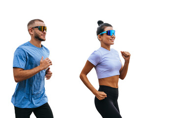 Young caucasian couple running against transparent background in sportswear and sunglasses. Fit...