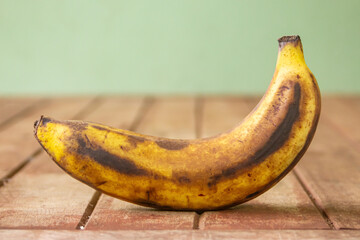 Rotten banana on wooden blurred