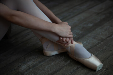 Legs of a ballerina in ballet shoes