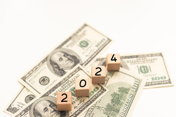 Business concept of 2024 top view with money bills. New year management, and financial plan