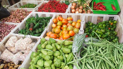 several kinds of vegetables in baskets are sold at traditional markets