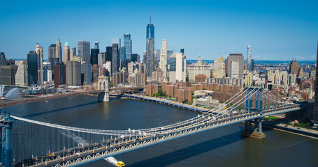 Iconic New York City Landscape Over East River with Skyscrapers, Manhattan and Brooklyn Bridges,...