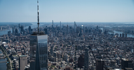 Aerial Photo with Top of the One World Trade Center Skyscraper with Antenna. Helicopter Flying...