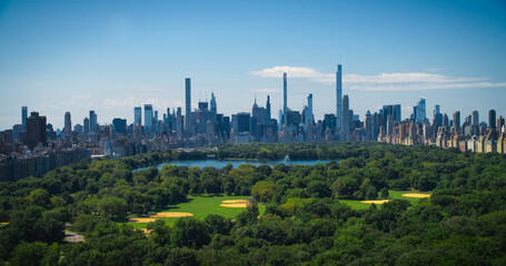 Aerial Helicopter Footage Over Central Park with Nature, Trees, People Having Picnic and Resting on...