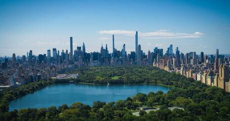 New York Cityscape on a Clear Day. Aerial Footage from a Helicopter. Modern Skyscraper Buildings Around Central Park in Manhattan Island. Focus on Architecture, City, Urban Life