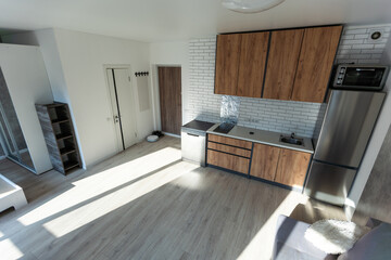 Clean kitchen in a small cozy contemporary studio apartment.