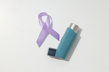 Epilepsy day concept, inhaler with lavender ribbon