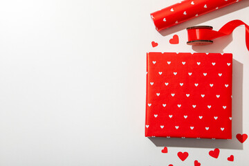 Red gift box on a soft broken background.