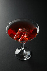 A tooth in the form of ice, in a glass with a cocktail.