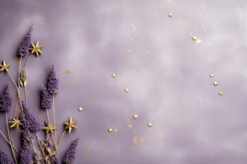  a bunch of purple flowers sitting on top of a purple surface with gold stars on the top of the flowers.