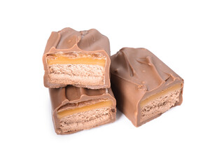 Pieces of tasty chocolate bars with nougat on white background