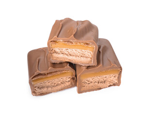Pieces of tasty chocolate bars with nougat on white background