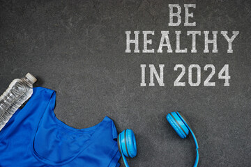 be healthy in 2024 concept new year, headphone with water bottle, shirt sport
