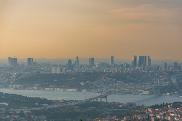 Istanbul Bosphorus Bridge at sunset and evening lights with colorful clouds in the sky
