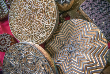 Womans hand working with fabric printing mold and ink traditional writing and woodblock printing work of Kastamonu and Anatolia region.