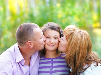 Fototapeta premium Happy young family with daughter
